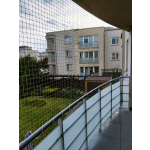 Montaż siatki zabezpieczającej na balkonie dla kota Warszawa