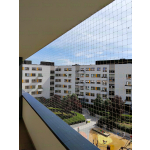 Bezinwazyjny Montaż siatki zabezpieczającej na balkonie przed gołębiami Warszawa